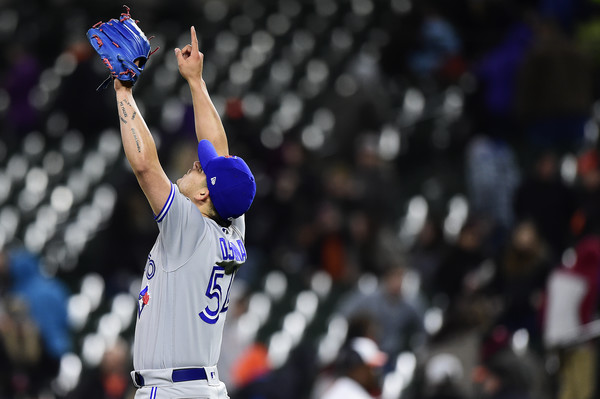 Roberto Osuna celebrates after becoming the youngest closer in Major League history to record 100 saves at 23 years and 62 days old. | Photo: Patrick McDermott/Getty Images