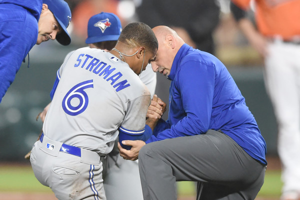 Blue Jays Head Trainer George Poulis works on Marcus Stroman after Stroman got hit in the right elbow by a line drive in the second inning. | Photo:Mitchell Layton/Getty Images