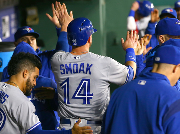 Justin Smoak celebrates after scoring in the third inning. | Photo: Rick Yeatts/Getty Images