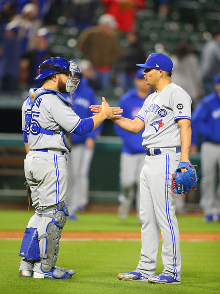 Roberto Osuna (R) and Russell Martin celebrate after closing out the win. | Photo: Rick Yeatts/Getty Images