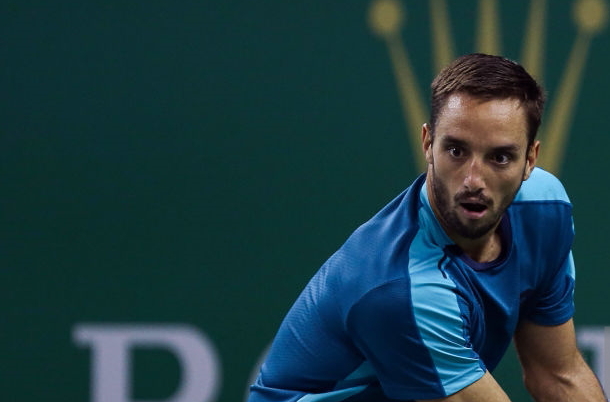 Photo Source: Yifan Ding/Getty Images-Viktor Troicki hitting another backhand winner.