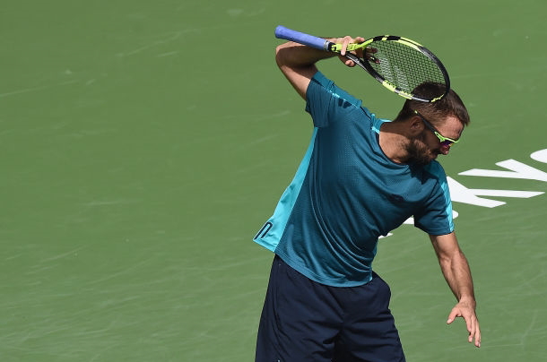 Photo Source: Matt Roberts/Getty Images-Viktor Troicki almost destroys his racquet in frustration.