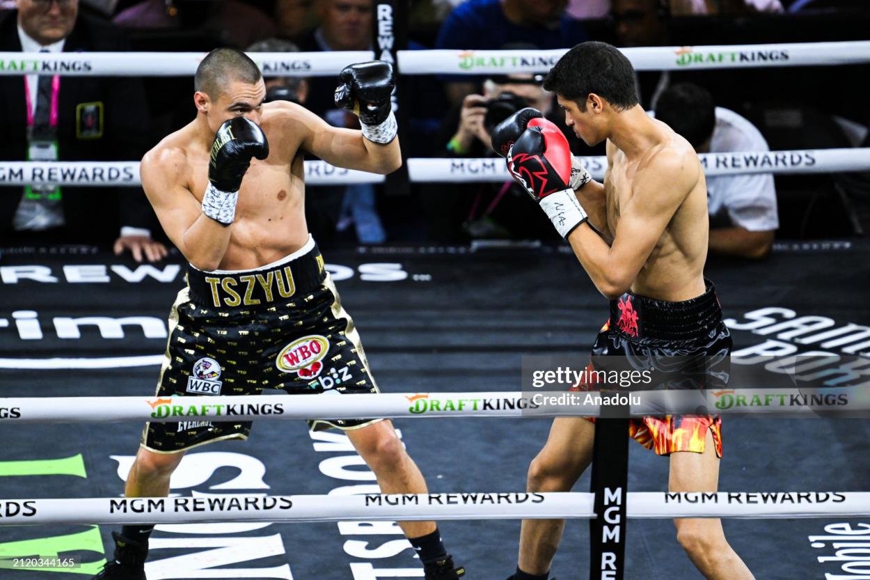 LAS VEGAS, NV - MARCH 30: Tim Tszyu (in gold & black short) and Sebastian Fundora (in red & black short) exchange punches during their super welterweight world titles of the Premiere Boxing Championship on Saturday night as Sebastian Fundora wins at the T-Mobile Arena in Las Vegas, Nevada, United States on March 30, 2024. (Photo by Tayfun Coskun/Anadolu via Getty Images)
