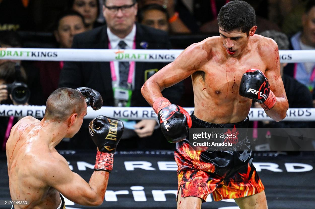 LAS VEGAS, NV - MARCH 30: (EDITORS NOTE: Image depicts graphic content) Tim Tszyu (in gold & black short) and Sebastian Fundora (in red & black short) exchange punches during their super welterweight world titles of the Premiere Boxing Championship on Saturday night as Sebastian Fundora wins at the T-Mobile Arena in Las Vegas, Nevada, United States on March 30, 2024. (Photo by Tayfun Coskun/Anadolu via Getty Images)