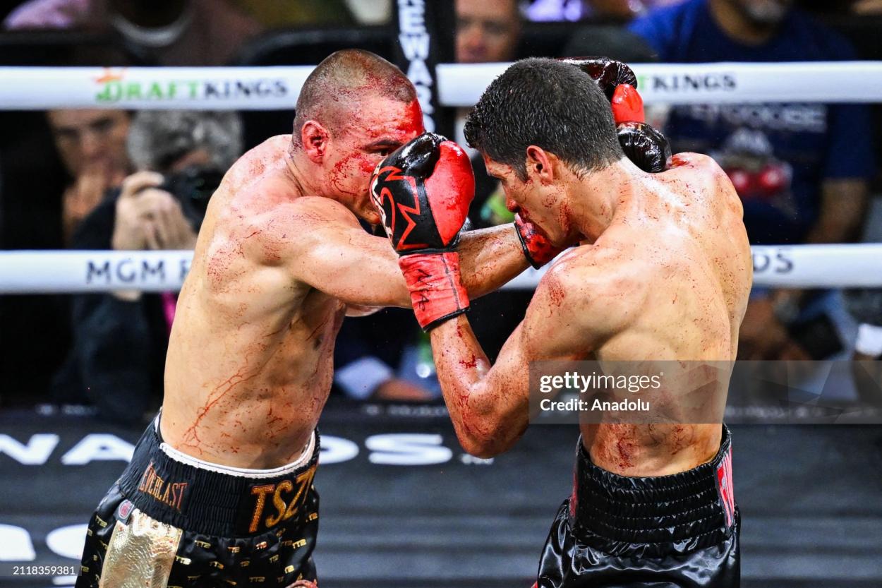 LAS VEGAS, NV - MARCH 30: (EDITORS NOTE: Image depicts graphic content) Tim Tszyu (in gold & black short) and Sebastian Fundora (in red & black short) exchange punches during their super welterweight world titles of the Premiere Boxing Championship on Saturday night as Sebastian Fundora wins at the T-Mobile Arena in Las Vegas, Nevada, United States on March 30, 2024. (Photo by Tayfun Coskun/Anadolu via Getty Images)