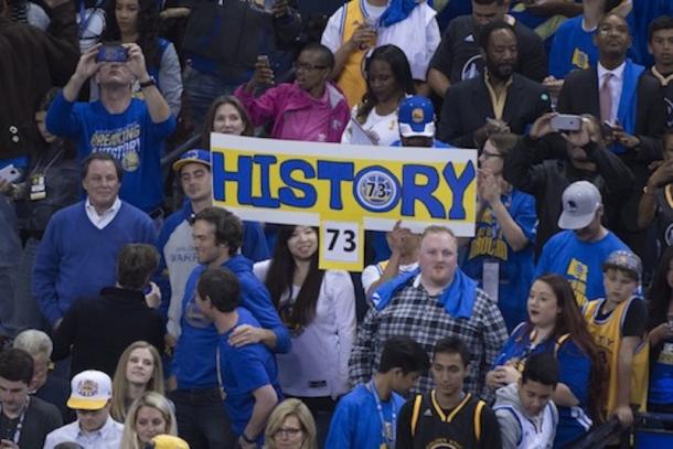 Warriors fans celebrating their team breaking the record for most wins in a regular season. Photo: Kyle Terada/USA Today