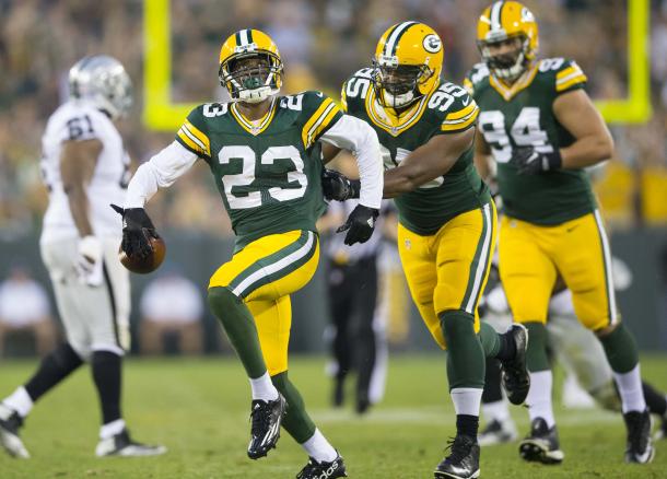 Damarious Randall celebrates the interception he got against Derek Carr, making it one of the only highlights of the half. Photo Credit: Jeff Hanisch/USA TODAY Images. 