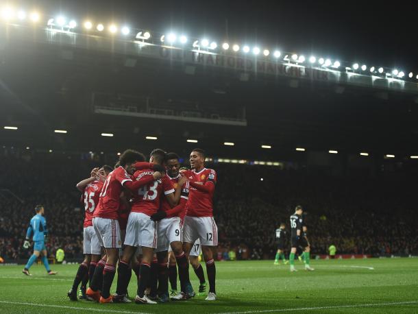 The Reds celebrate a goal at Old Trafford (Getty)