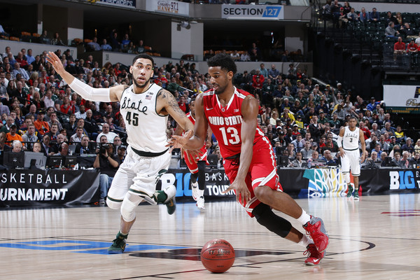 JaQuan Lyle #13 of the Ohio State Buckeyes drives against Denzel Valentine #45 of Michigan State Spartans in the quarterfinal round of the Big Ten Basketball Tournament at Bankers Life Fieldhouse on March 11, 2016 in Indianapolis, Indiana. (March 10, 2016 - Source: Joe Robbins/Getty Images North America)