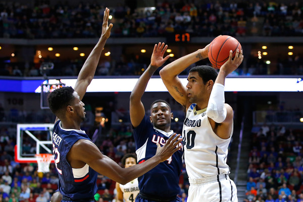 Josh Scott #40 of the Colorado Buffaloes handles the ball against Kentan Facey #12 and Sterling Gibbs #4 of the Connecticut Huskies in the first half during the first round of the 2016 NCAA Men's Basketball Tournament at Wells Fargo Arena on March 17, 2016 in Des Moines, Iowa. (March 16, 2016 - Source: Kevin Cox/Getty Images North America)