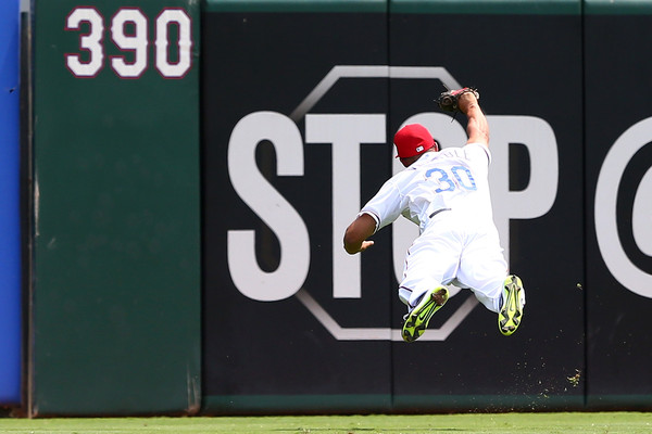 Will Venable #30 of the Texas Rangers makes a diving catch in the second inning during a game against the Toronto Blue Jays. (Aug. 26, 2015 - Source: Sarah Crabill/Getty Images North America)