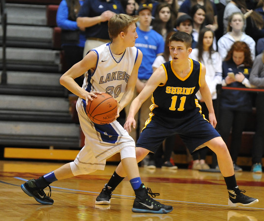 Noah Robak makes a pass with Ian Gappy defending. (Ken Swart / MIPrepZone)