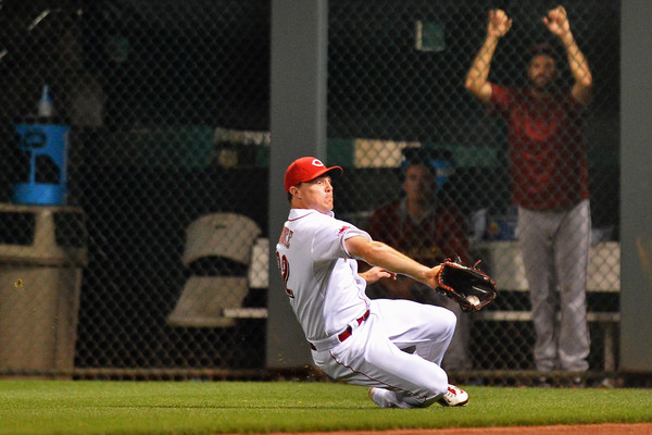 Jay Bruce #32 of the Cincinnati Reds makes a sliding catch for an out in right field in the eighth inning against the Arizona Diamondbacks. (Aug. 21, 2015 - Source: Jamie Sabau/Getty Images North America) 