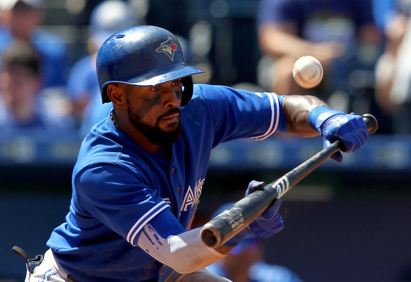 Jose Reyes #7 of the Toronto Blue Jays bunts during the 9th inning of the game against the Kansas City Royals. (July 10, 2015 - Source: Jamie Squire/Getty Images North America)