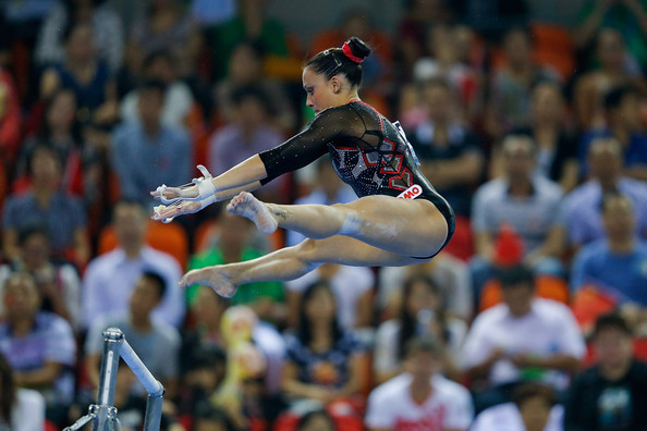 Vanessa Ferrari performs on the uneven bars at the 2014 World Artistic Gymnastics Championships in Nanning/Getty Images