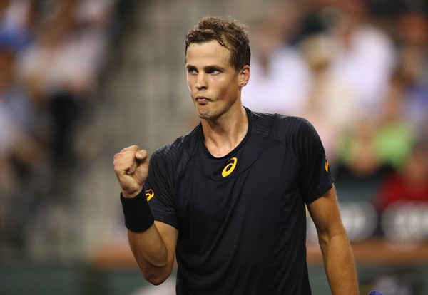 Vasek Pospisil celebrates after winning a point during his second-round match against Andy Murray at the 2017 BNP Paribas Open. | Photo: Clive Brunskill/Getty Images