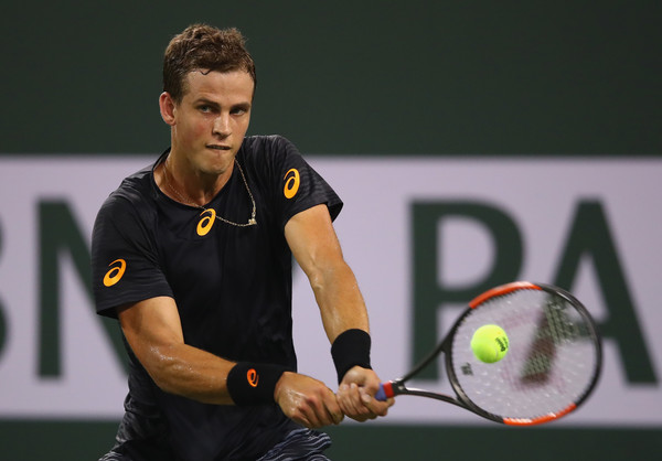 Vasek Pospisil hits a backhand during his second-round match against Andy Murray at the 2017 BNP Paribas Open. | Photo: Clive Brunskill/Getty Images
