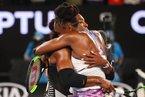 Serena (L) and Venus Williams embrace at the net after their 2017 Australian Open final, the first time they have met in a major final since 2009. | Photo: Scott Barbour/Getty Images