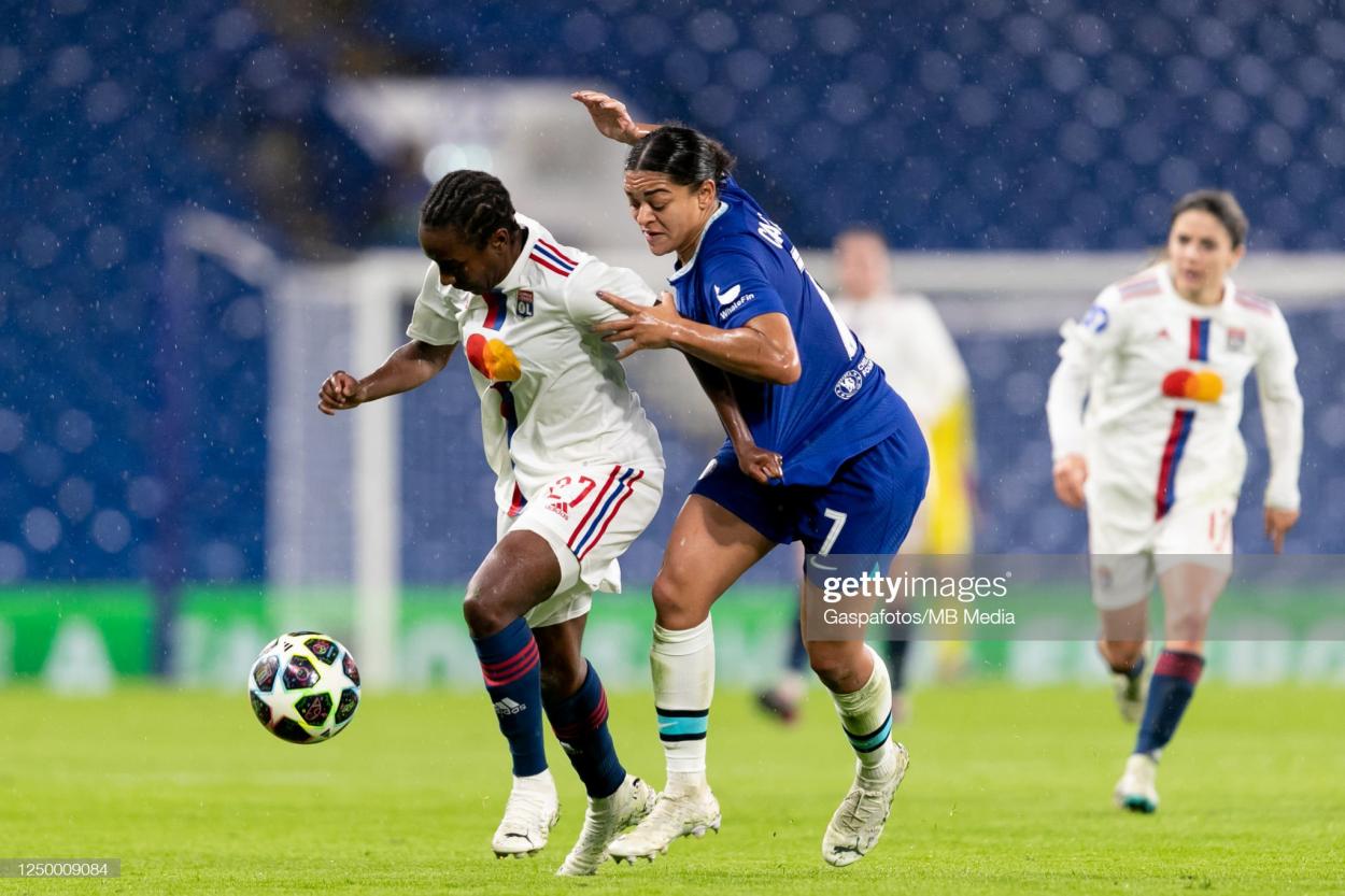  Vicki Becho of Olympique Lyonnais is challenged by Jess Carter of Chelsea Women during the UEFA Women's <strong><a  data-cke-saved-href='https://www.vavel.com/en/football/2023/03/30/womens-football/1142204-vfl-wolfsburg-vs-psguefa-womens-champions-league-preview-quarter-final-second-leg-2023.html' href='https://www.vavel.com/en/football/2023/03/30/womens-football/1142204-vfl-wolfsburg-vs-psguefa-womens-champions-league-preview-quarter-final-second-leg-2023.html'>Champions League</a></strong> quarter-final 2nd leg match between Chelsea FC and Olympique Lyonnais at Stamford Bridge on March 30, 2023 in London, United Kingdom. (Photo by Gaspafotos/MB Media/Getty Images)