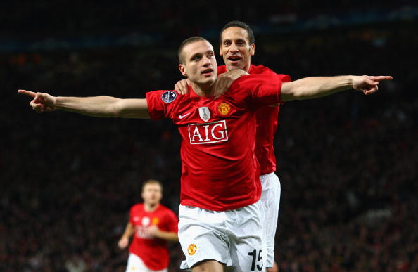 Vidic celebrates with partner Ferdinand | Photo: Laurence Griffifths/Getty Images