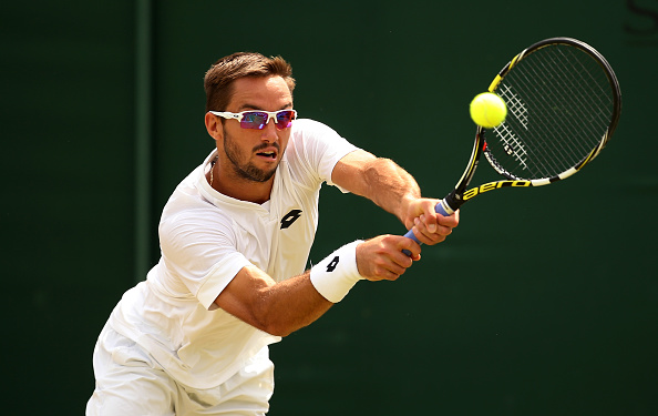 Troicki plays a backhand in his Gentlemen's Singles Fourth Round match against Vasek Pospisil of Canada during day seven of the Wimbledon Lawn Tennis Championships at the All England Lawn Tennis and Croquet Club on July 6, 2015 in London, England. (Photo by Ian Walton/Getty Images)