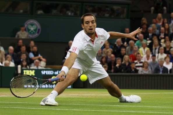 Troicki hits a forehand return during his Gentlemen's Singles fourth round match against Novak Djokovic of Serbia on day seven of the Wimbledon Lawn Tennis Championships at the All England Lawn Tennis and Croquet Club on July 2, 2012 in London, England.