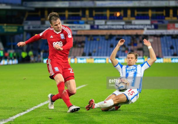 27th January 2018, John Smith's Stadium, Huddersfield, England; FA Cup football, 4th round, Huddersfield Town versus Birmingham City; Carl Jenkinson of Birmingham City crosses the ball under pressure from Chris Lowe of Huddersfield Town (Photo by Conor Molloy/Action Plus via Getty Images)