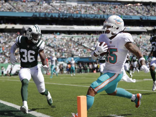 Wilson strolls into the end zone to give Miami a two touchdown lead/Photo: Julio Gomez/Associated Press