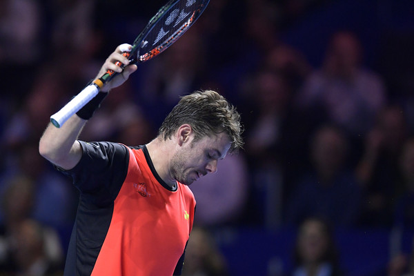 Wawrinka tosses his racquet to the court in frustration. Photo: Harold Cunningham/Getty Images
