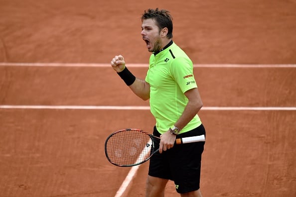 Stan Wawrinka roars after winning the third set. Photo: Philippe Lopz/AFP/Getty Images