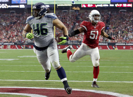 Will Tukuafu scored a touchdown against the Arizona Cardinals on the final game of the 2015 NFL season | Source: Ross D. Franklin - AP Photo