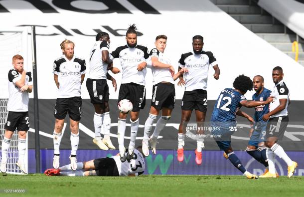 Willian hits a free-kick against Fulham during the Premier League match between Fulham and Arsenal at Craven Cottage. (Photo by Stuart MacFarlane/Arsenal FC via Getty Images)