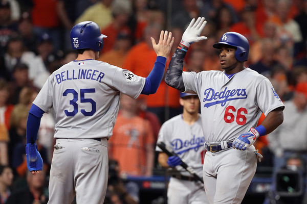 Puig celebrates with Bellinger after his ninth-inning homer brought the Dodgers to within one/Photo: Christian Petersen/Getty Images