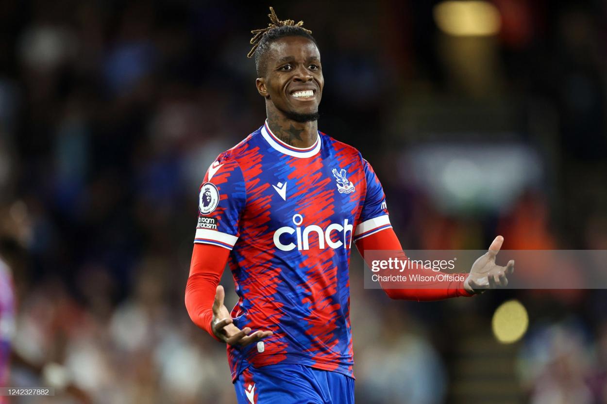LONDON, ENGLAND - AUGUST 05: Wilfried Zaha of <strong><a  data-cke-saved-href='https://www.vavel.com/en/football/2022/08/04/arsenal/1118835-mikel-arteta-says-hes-enthusiastic-ahead-of-arsenals-visit-to-crystal-palace.html' href='https://www.vavel.com/en/football/2022/08/04/arsenal/1118835-mikel-arteta-says-hes-enthusiastic-ahead-of-arsenals-visit-to-crystal-palace.html'>Crystal Palace</a></strong> during the Premier League match between Crystal Palace and Arsenal FC at Selhurst Park on August 5, 2022 in London, United Kingdom. (Photo by Charlotte Wilson/Offside/Offside via Getty Images)