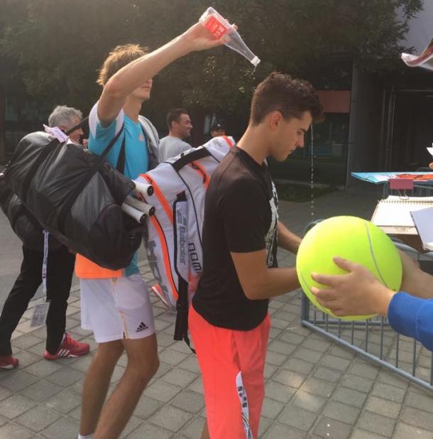 Alexander Zverev (left) dumps a bottle of water on Dominic Thiem's head. Photo: China Open