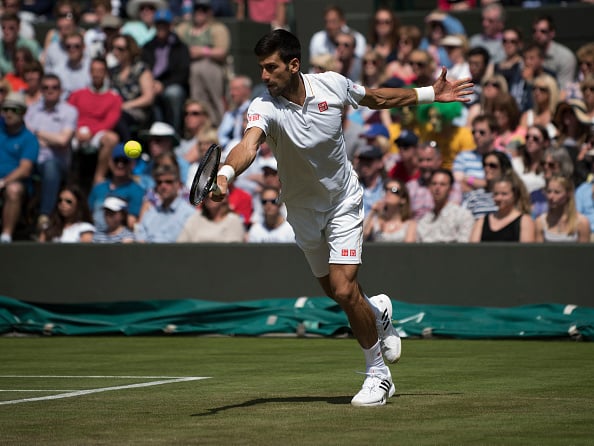 Novak Djokovic stretching for a shot (Photo: Icon Sportswire)