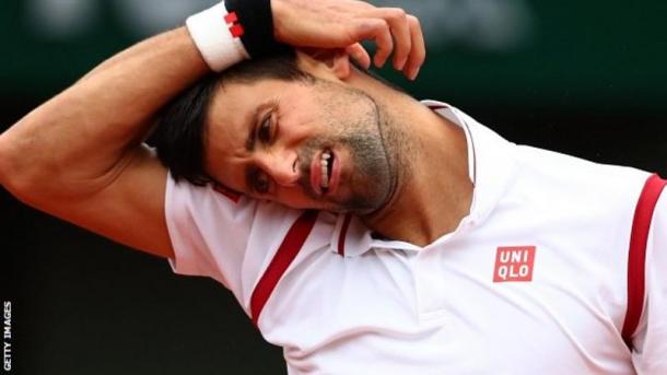 Djokovic endured a tough start to the match, but narrowly leads after it was stopped. (Photo: Getty)