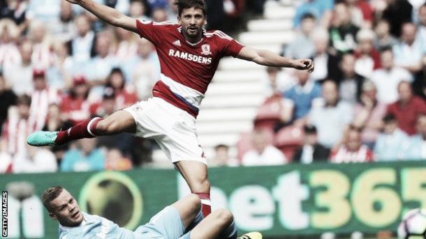 Gaston Ramirez shoots towards Shay Given's goal as Shawcross looks on. | Photo: Getty Images.