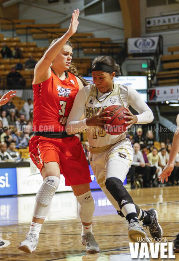 Breanna Mobley (10) tries to get around Andrea Cecil (3). Photo: Walter Cronk