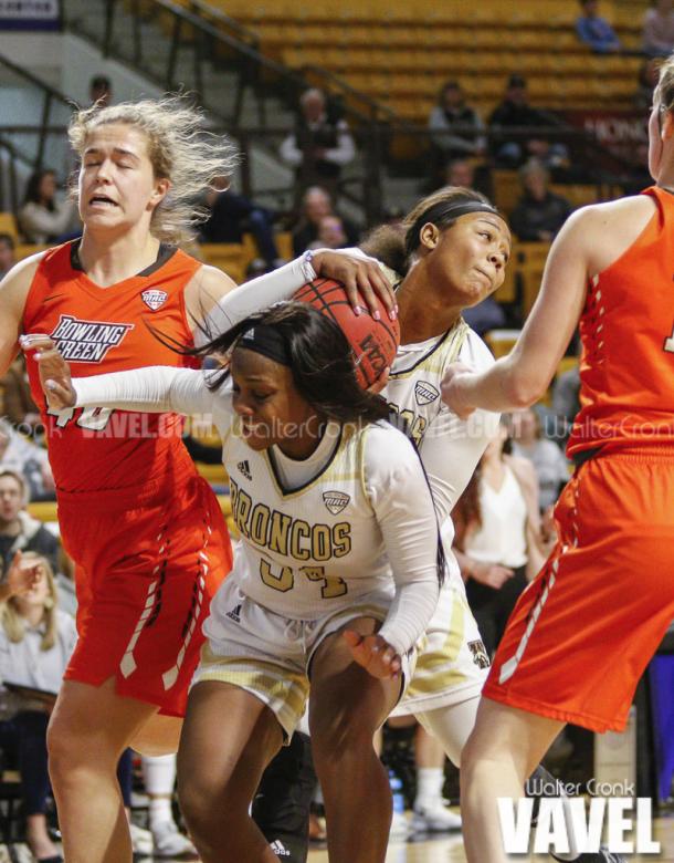 Breanna Mobley (10) fights for a rebound under the basket. Photo: Walter Cronk