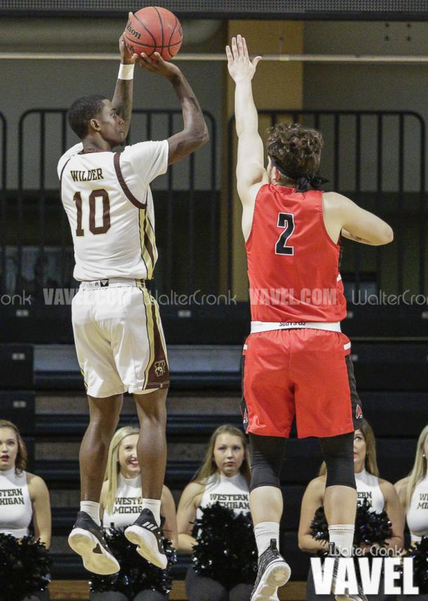 Thomas Wilder (10) takes the jump shot before Tayler Persons (2) can get to him. Photo: Walter Cronk