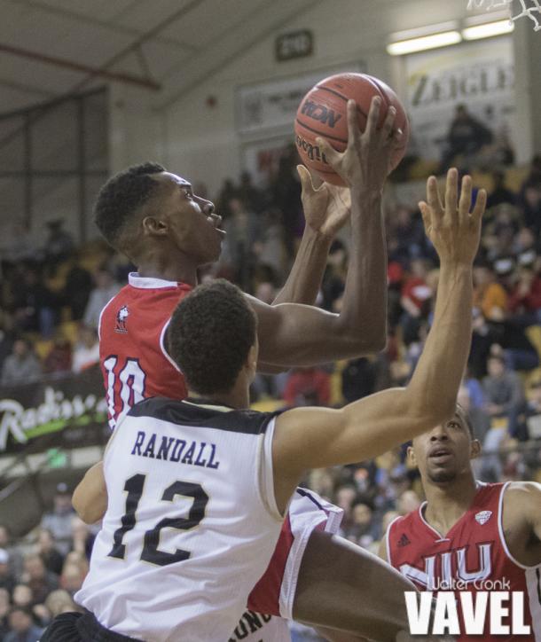Eugene German (10) of Northern Illinois gets past the defense and to the basket. Photo: Walter Cronk