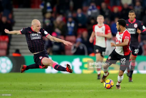 SOUTHAMPTON, ENGLAND - DECEMBER 23: Huddersfieldâs Aaron Mooy(L) launches into tackle on Nathan Redmond(R) during the Premier League match between Southampton and Huddersfield Town at St Mary's Stadium on December 23, 2017 in Southampton, England. (Photo by Matt Watson/Southampton FC via Getty Images)