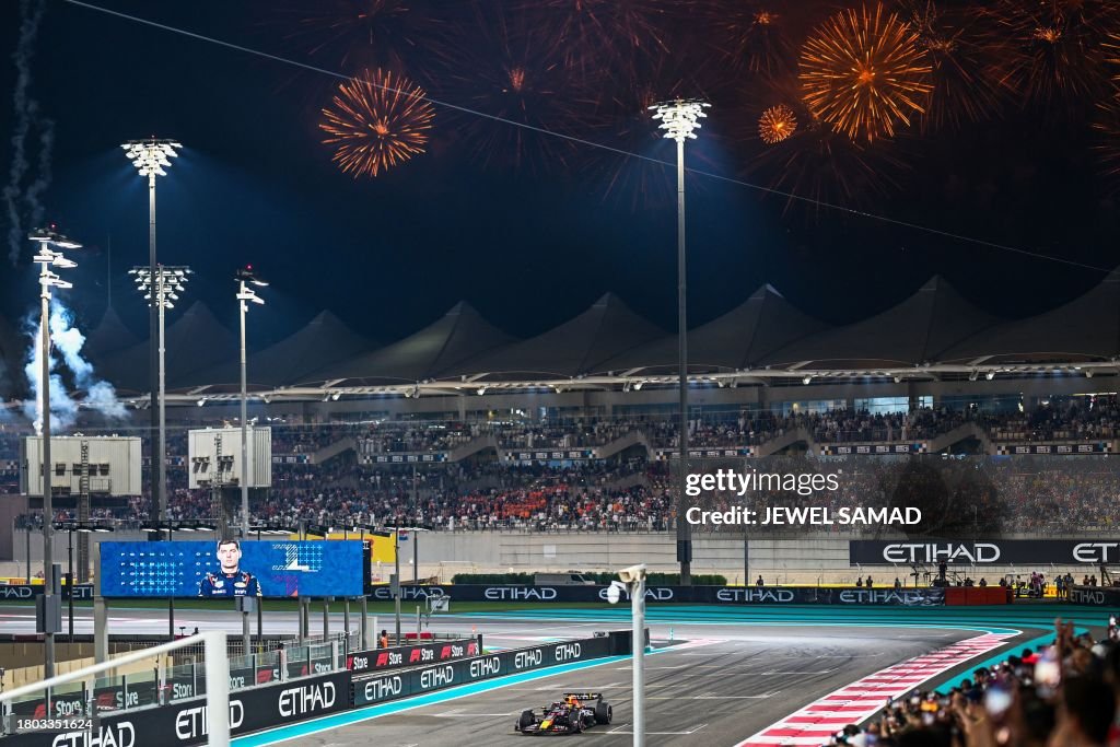 Red Bull Racing's Dutch driver Max Verstappen crosses the finish line to win the Abu Dhabi <strong><a  data-cke-saved-href='https://www.vavel.com/en/motorsports/2023/10/20/formula-1/1159838-united-states-grand-prix-formula-one-preview-race-20-2023.html' href='https://www.vavel.com/en/motorsports/2023/10/20/formula-1/1159838-united-states-grand-prix-formula-one-preview-race-20-2023.html'>Formula One</a></strong> Grand Prix at the Yas Marina Circuit in the Emirati city on November 26, 2023. (Photo by Jewel SAMAD / AFP) (Photo by JEWEL SAMAD/AFP via Getty Images)