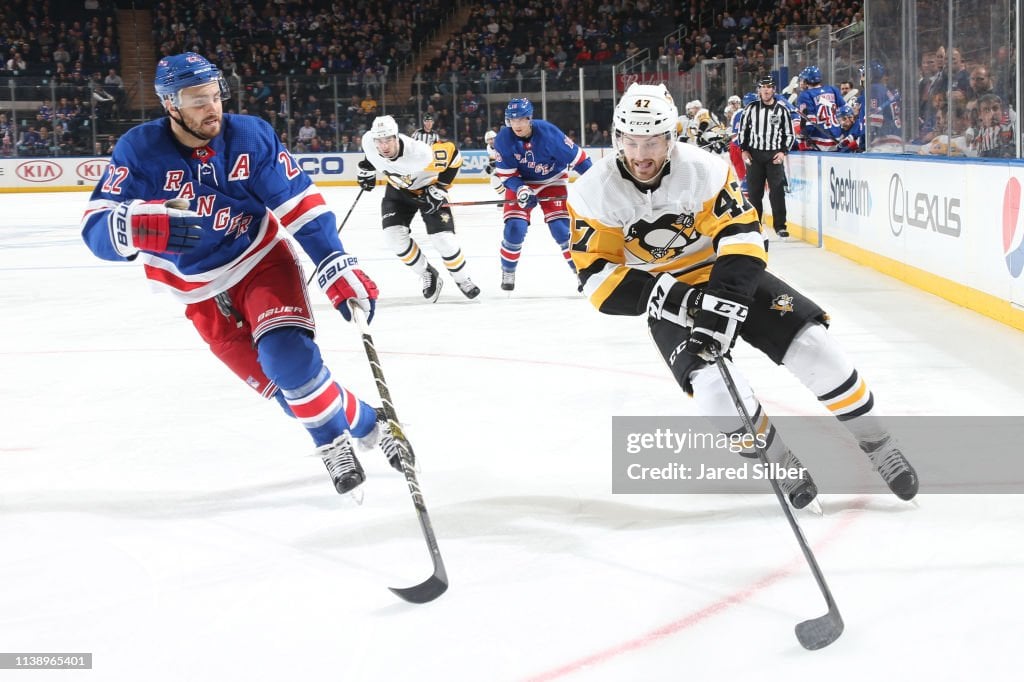 Adam Johnson #47 of the Pittsburgh Penguins skates with the puck against Kevin Shattenkirk #22 of the New York Rangers at Madison Square Garden on March 25, 2019 in New York City. The Pittsburgh Penguins won 5-2. (Photo by Jared Silber/NHLI via Getty Images)