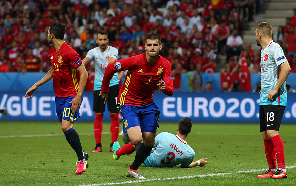 Morata (pictured, middle) celebrates his strike against Turkey - one of three goals he's netted at this tournament. | Photo: Getty