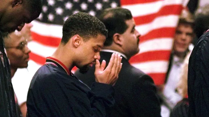Mahmoud Abdul Rauf making Duaa (an Islamic prayer) during his first appearance back since his first NBA suspension in 1996 for not standing during the national anthem. AP Photo/M. Spencer Green