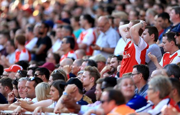 Arsenal fans react to the opening day defeat against Liverpool (photo; EMPICS Sport)