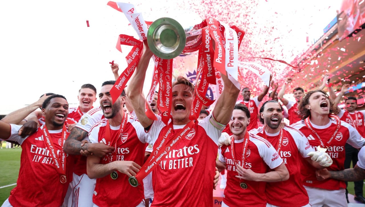 Arsenal players lifting the Premier League trophy in May 2026