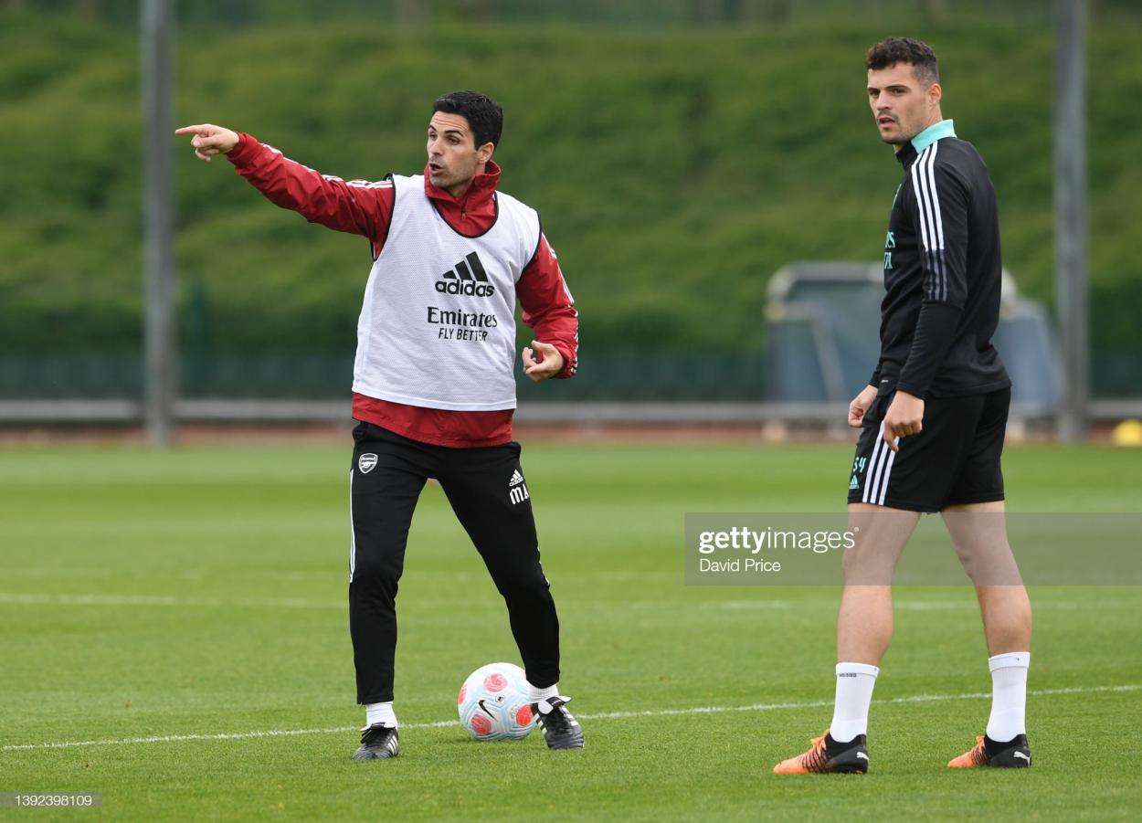 ST ALBANS, ENGLAND - APRIL 19: Arsenal Manager Mikel Arteta with Garnit Xhaka of Arsenal during the Arsenal Men's training session at London Colney on April 19, 2022 in St Albans, England. (Photo by David Price/Arsenal FC via Getty Images)